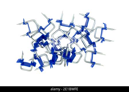 Group of electric wire staples with plastic saddle isolated on a white background. Stock Photo