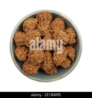 Top view of a bowl filled with gluten free chocolate macaroons isolated on a white background. Stock Photo