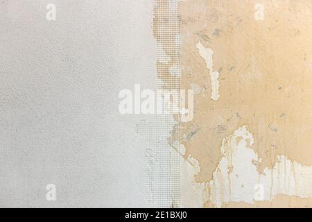 Home Renovation. Half plastered wall with fiberglass gauze. Stock Photo