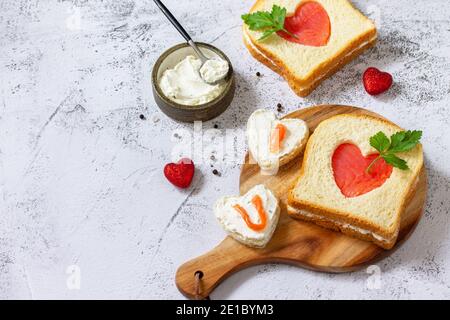 Breakfast for valentine's day or mother's day, toast with salmon and curd cheese with the inscription that I love you. Copy space. Stock Photo
