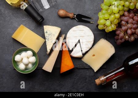 Various cheese, grapes and white wine. Top view flat lay Stock Photo