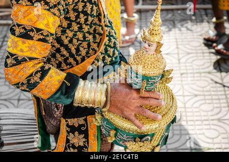 performer with traditional Lakhon Khol mask dance ceremony costume at Wat Svay Andet UNESCO Intangible Cultural Heritage site in Kandal province Cambo Stock Photo