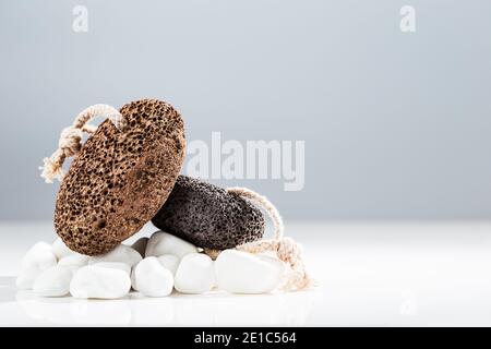 Brown and black pumice stone for home spa over white background Stock Photo