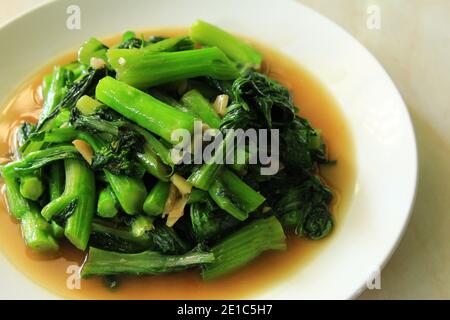 Stir -fried choy sum vegetable on the plate. stock photo Stock Photo