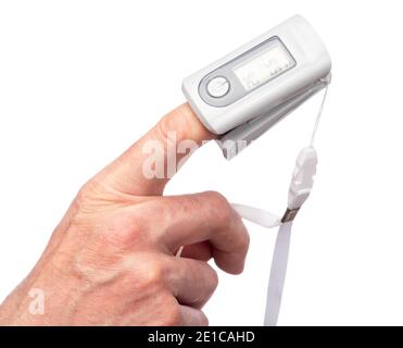 Close-up shot of person using finger pulse oximeter to check oxygen saturation and heart rate tracking coronavirus symptoms - epidemic virus outbreak Stock Photo