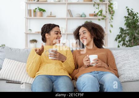 Hot drink, good mood and communication with friend at home Stock Photo