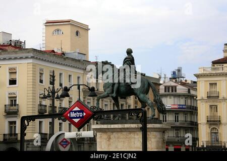 Statue of King Carlos III in Puerta del Sol square next to Metro station. Stock Photo