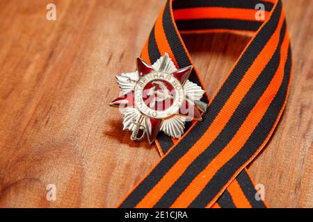 Symbols of Victory in Great Patriotic War on wooden background Stock Photo