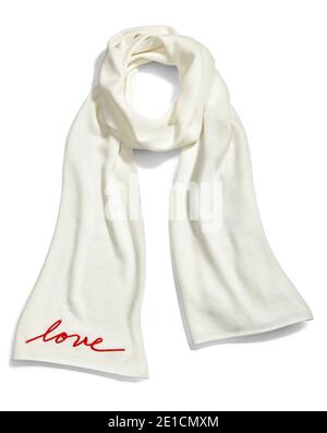 White knit scarf with embroidered word "love" photographed on a white background Stock Photo