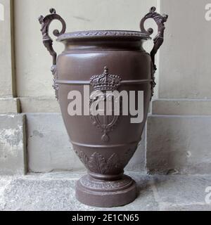 Turin, Italy - september 2020: large bronze vase with the coat of arms of the Savoy family in the royal palace Stock Photo