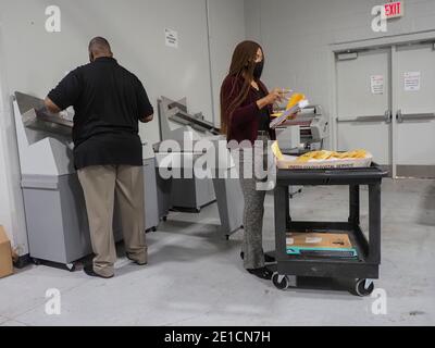 January 6, 2021, Lawrenceville, Georgia, USA: Mail-in absentee ballots have been sorted into their precincts, marked by the numbered marigold sheets, and are being prepared for the next steps in processing. (Credit Image: © Sue Dorfman/ZUMA Wire) Stock Photo