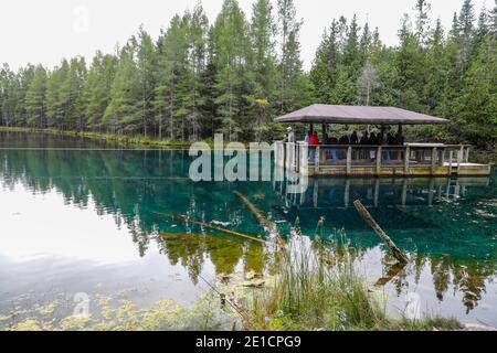A view of Kitch-iti-kipi, Michigan's largest natural freshwater spring. The name means big cold water and is sometimes referred to as The Big Spring. Stock Photo