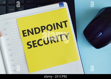 Handwriting text writing Endpoint Security. Concept meaning the methodology of protecting the corporate network. Pencil, square, notebook, blue color Stock Photo