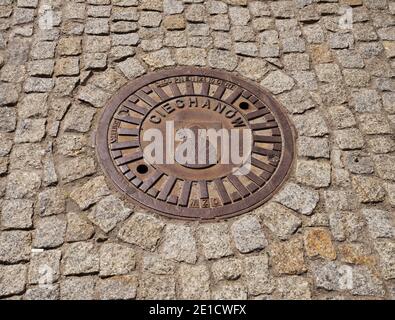 Manhole at Warszawska street in Ciechanow. Poland Stock Photo