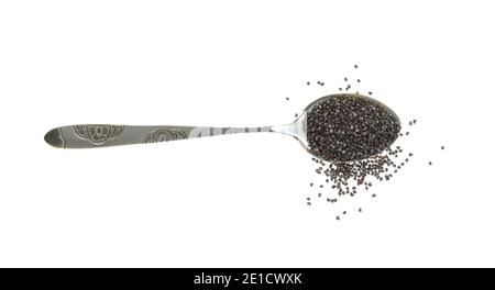 Poppy seeds in a metal spoon isolated on white background. Heap of dry poppy seeds Stock Photo