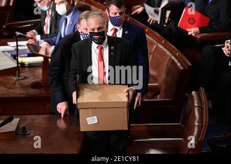 Washington, USA. 06th Jan, 2021. Electoral College ballot boxes arrive to a joint session of Congress to count the Electoral College votes of the 2020 presidential election in the House Chamber in Washington, DC, U.S., on Wednesday, Jan. 6, 2021. Congress is meeting to certify Joe Biden as the winner of the 2020 presidential election, with scores of Republican lawmakers preparing to challenge the tally in a number of states during what is normally a largely ceremonial event. (Photo by Erin Scott/Pool/Sipa USA) Credit: Sipa USA/Alamy Live News Stock Photo