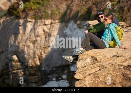 Young couple hiking at sunset in Capo Testa Sardinia. Images shot