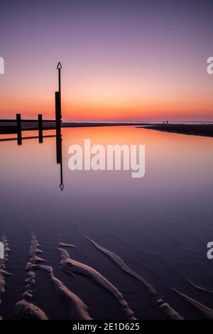 Rhyl beach at sunset on the North Wales coast Stock Photo