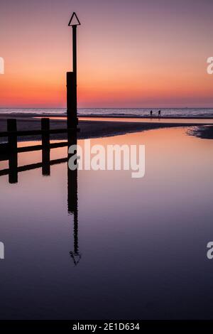Rhyl beach at sunset on the North Wales coast Stock Photo