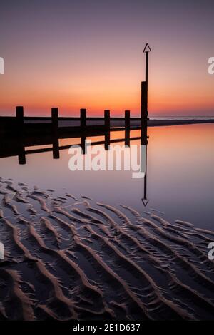 Rhyl beach at sunset on the North Wales coast Stock Photo