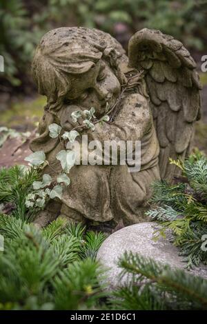 angel statue on an old grave Stock Photo