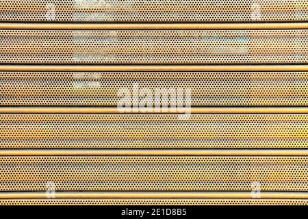 Perforated corrugated metal sheet. Abstract background. Close-up Stock Photo