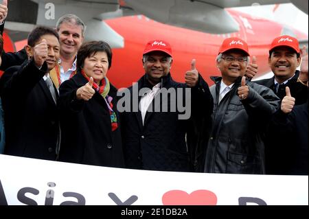 Dato Seri Ng Yen Yen, Dato Seri Dr. Tony Fernandes and Dato Azizan Noordin attending arrival of the first flight AirAsia X Kuala Lumpur /Paris-Orly in Orly near Paris, France on February 14, 2011. Photo by Nicolas Briquet/ABACAPRESS.COM Stock Photo