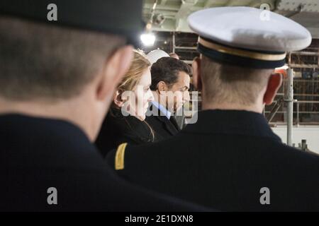 French president Nicolas Sarkozy visits an helicopter carrier ship flanked by Minister for Ecology and sustainable Development Nathalie Kosciusko-Morizet at the STX shipyard in Saint-Nazaire, western France on January 25, 2011. Nicolas Sarkozy is on an one day visit at the STX shipyard to sign a contract between France and Russia on ship building. Photo by Lionel Bonaventure/Pool/ABACAPRESS.COM Stock Photo