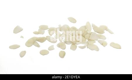 Pile of peeled flaked almonds isolated on white. Blanched almonds flakes on white. Stock Photo