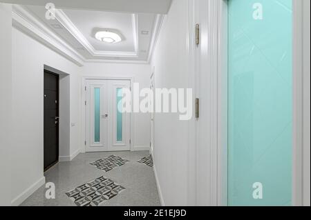 interior of white corridor with doors Stock Photo