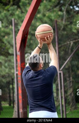 man playing basketball Stock Photo