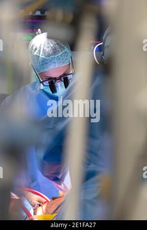 close up view of a heart surgeon wearing his magnifying glasses Stock Photo