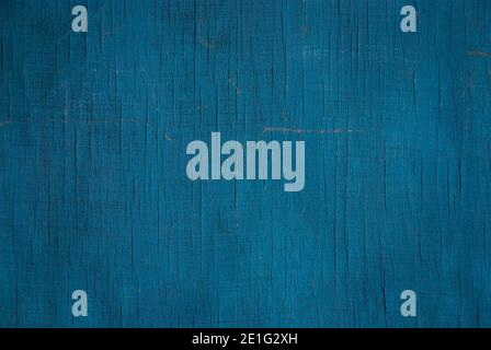 dark blue-green texture of faded plywood wall with cracks, scratches and stains Stock Photo