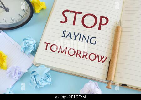 Stop Saying Tomorrow words written on notebook. Concept meaning way of encouraging you to act now. Business photo showcasing be urgent in your decisio Stock Photo
