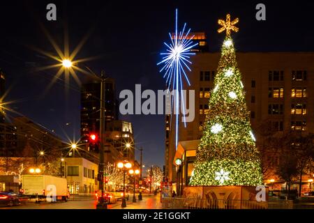 WA19039-00...WASHINGTON - The Westlake Center tree and the Seattle Star located across the street from the Westlake Park in downtown Seattle. 2020 Stock Photo