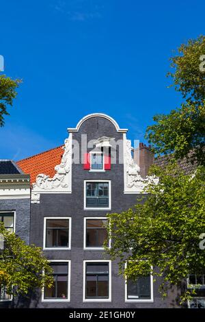 A typical gabled Dutch house on Prinsengracht Canal in Amsterdam, Netherlands. Stock Photo