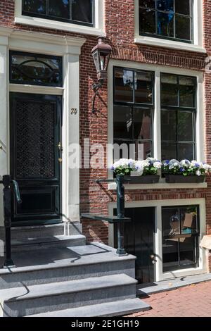 Front facade view of an elegant canal house in Amsterdam, Netherlands. Stock Photo