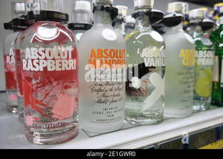 Bottles of Absolut Vodka. Different kinds of Absolut Vodka in supermarket Stock Photo