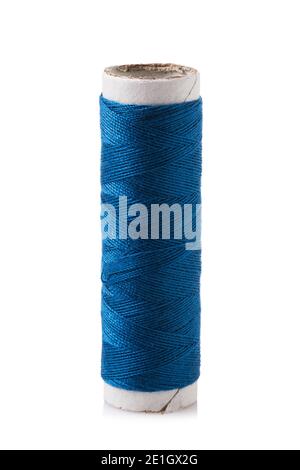 Spool of thread in blue isolated on white background. Stock Photo