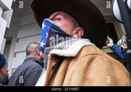 Washington Dc, United States. 06th Jan, 2021. A supporter of Donald Trump outside the door of the United States Capitol during the Pro-Trump rally.Pro-trump supporters stormed the United States Capitol after the loss of US President Donald Trump at the election. Credit: SOPA Images Limited/Alamy Live News Stock Photo