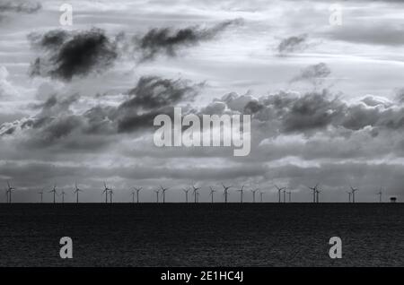 rampion wind farm on horizon in black and white Stock Photo