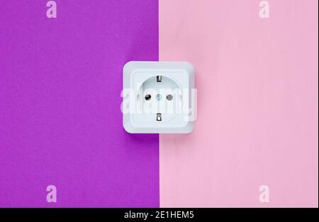 White plastic power socket on pastel background. Minimalism Stock Photo
