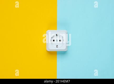 White plastic power socket on pastel background. Minimalism Stock Photo