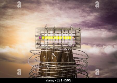 Eraser in a cage on the top of a mountain at sunset magenta day. School education is prisoner in metal cage or No freedom for school or back to school Stock Photo
