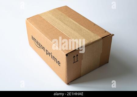Istanbul Turkey - 11.24.2020: Amazon Prime box on white background. Amazon shipping box from top with shadows. Stock Photo