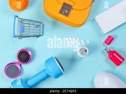 Miscellaneous shopping items on blue background. Top view. Stock Photo