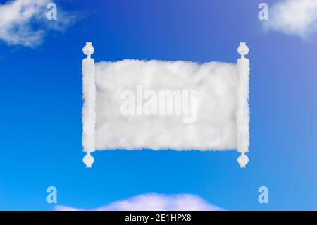 opened scroll of papyrus shape of cloud on blue sky. Stock Photo