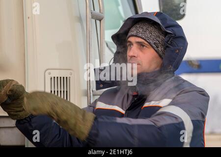 The driver of the hydraulic manipulator in the workplace Stock Photo