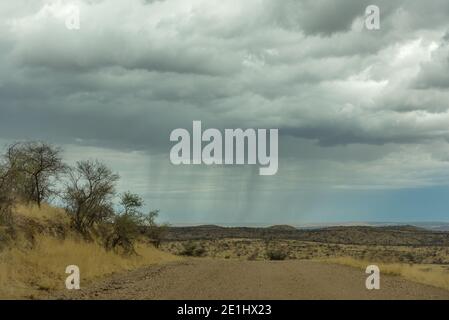 Landscape with rain clouds in the west of the capital Windhoek, Namibia Stock Photo