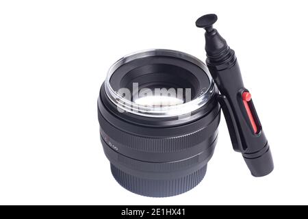 Camera lens and lens cleaner pen Isolated on a white background. Stock Photo